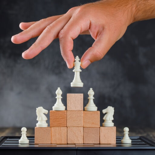 business-success-concept-with-chessboard-side-view-man-placing-figure-pyramid-blocks